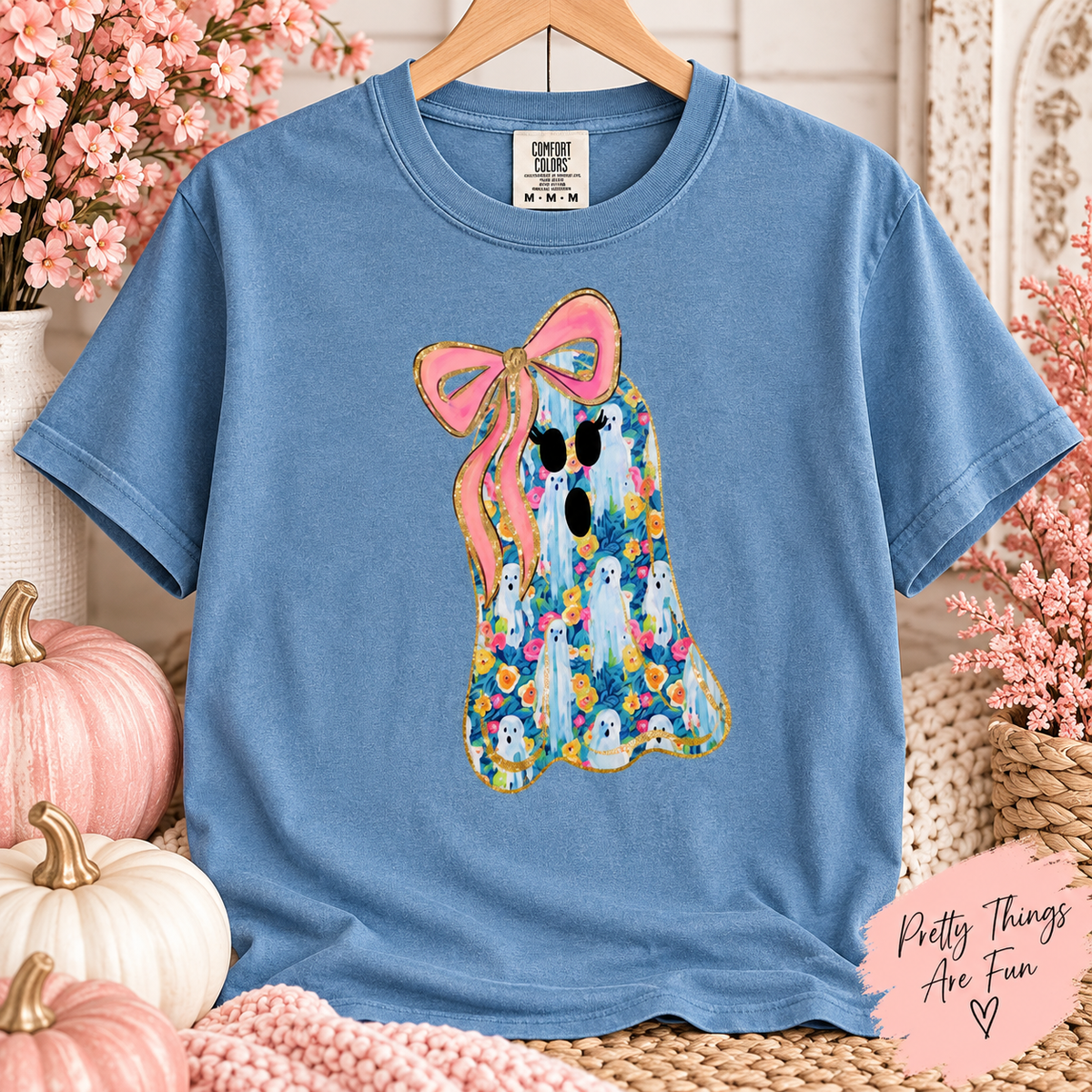 Ghost graphic tee with colorful floral print and a pink bow on a Comfort Colors 1717 shirt