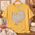 Mustard Comfort Colors tee featuring a turkey silhouette filled with neutral leopard print