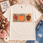 Ivory fall graphic tee with a colorful leaf, pumpkin, and acorn design